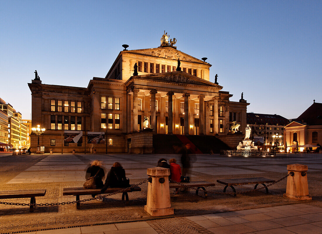 People in front of the Schauspielhaus at night, Gendarmenmarkt, Mitte, Berlin, Germany, Europe