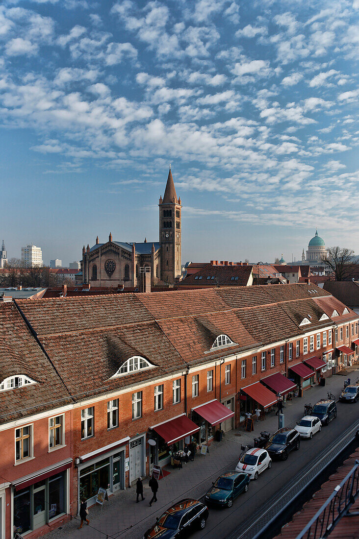 Friedrich Ebert Street at Dutch Quarter, St. Peter and Paul Church and St. Nicholas Church in the background, Potsdam, Brandenburg, Germany, Europe