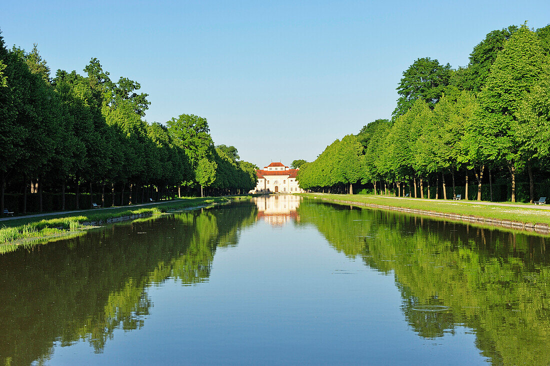 Lustheim castle reflecting in the canal, Schleissheim, Munich, Bavaria, Germany, Europe