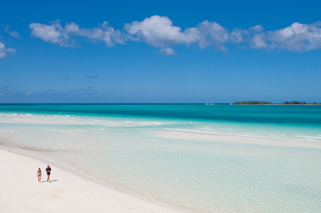 People strolling along Playa Pilar beach with Cayo Media Luna in the distance, Cayo Guillermo (Jardines del Rey), Ciego de Avila, Cuba