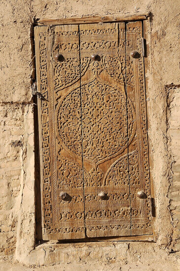 historic carved wooden door, Khiva, Chiva, Silk Road, Unesco World Heritage Site, Uzbekistan, Central Asia