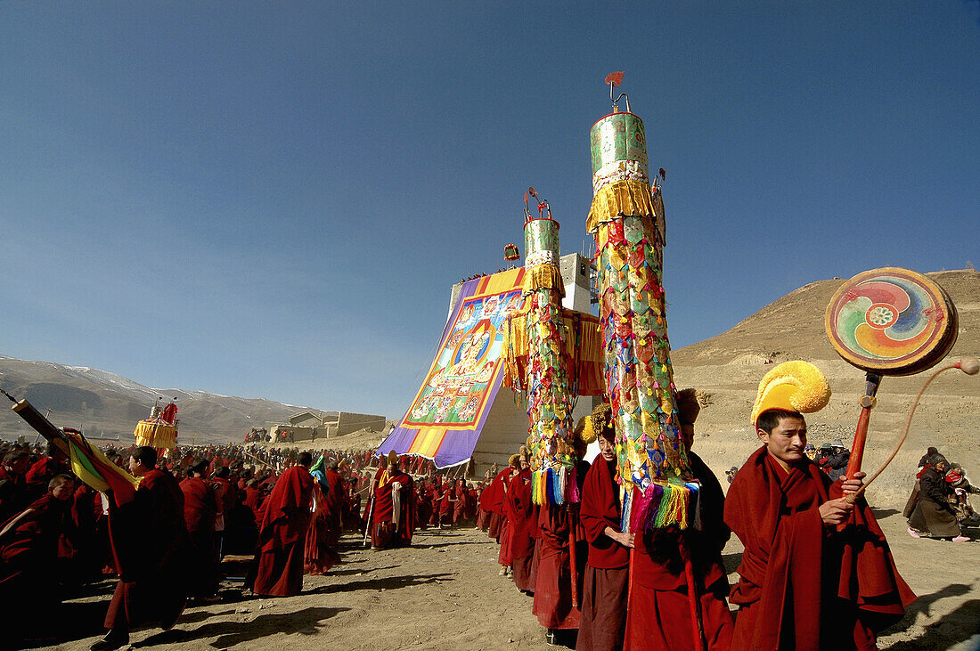 Gelug (Yellow Hat sect) monks procession, Gerdeng Tibetan Monastery in Aba, Sichuan, China