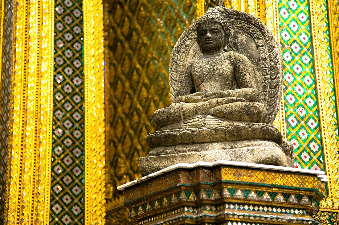 Thailand, Bangkok, The Grand Palace Statue in the ornate setting of the golden grand palace