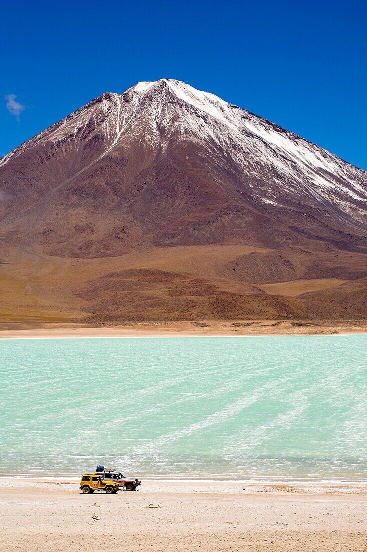 Bolivia, Southern Altiplano, Laguna Verde Tourist trip 4x4s parked near Laguna Verde and Volcan Licancabur