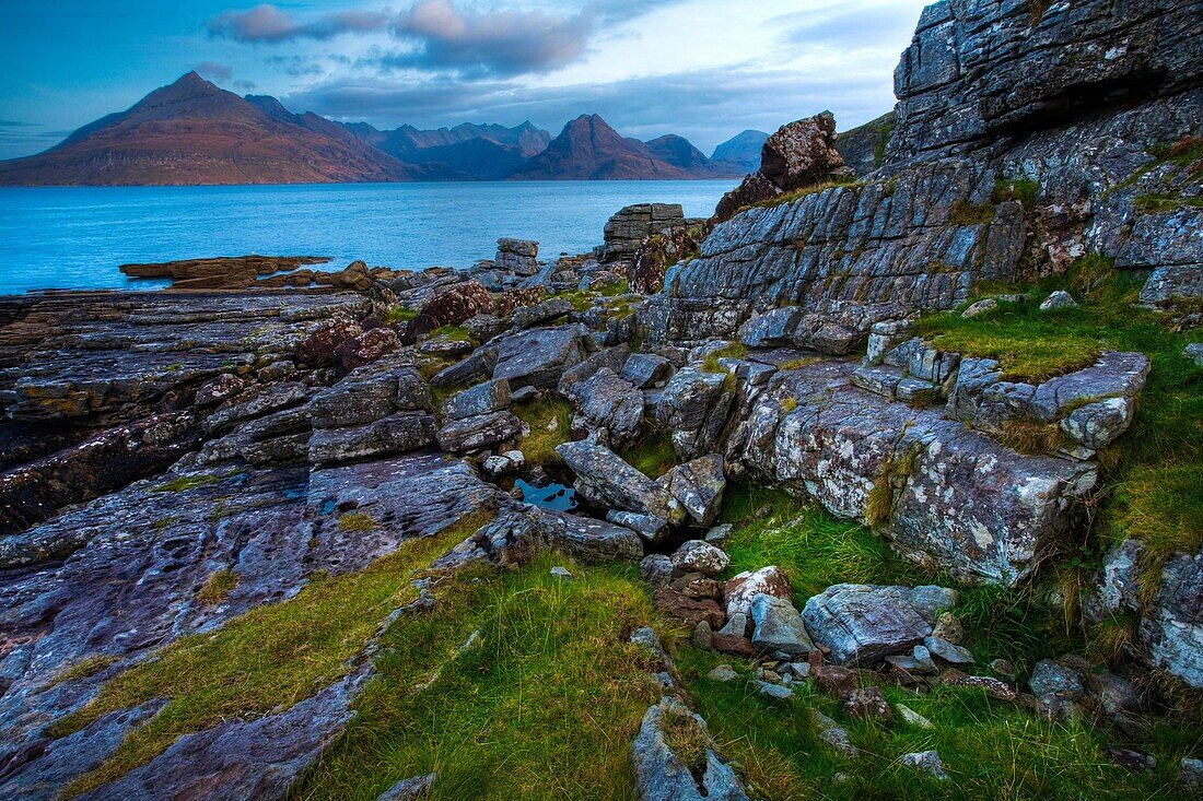 Scotland, Isle Of Skye, Elgol Looking across the rocky shoreline north of Elgol towards the peaks of the Black Cuillins