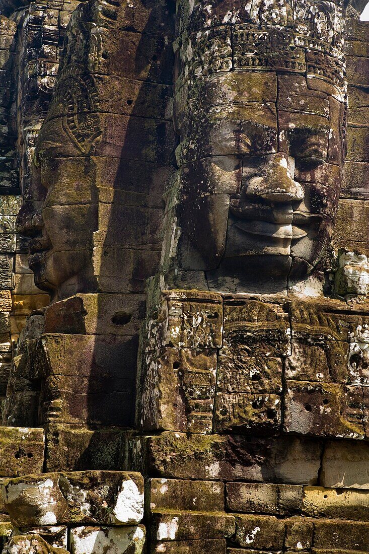Cambodia, Angkor Thom, Bayon Massive stone faces watch your every move at Bayon, a well-known and richly decorated Khmer temple at Angkor in Cambodia