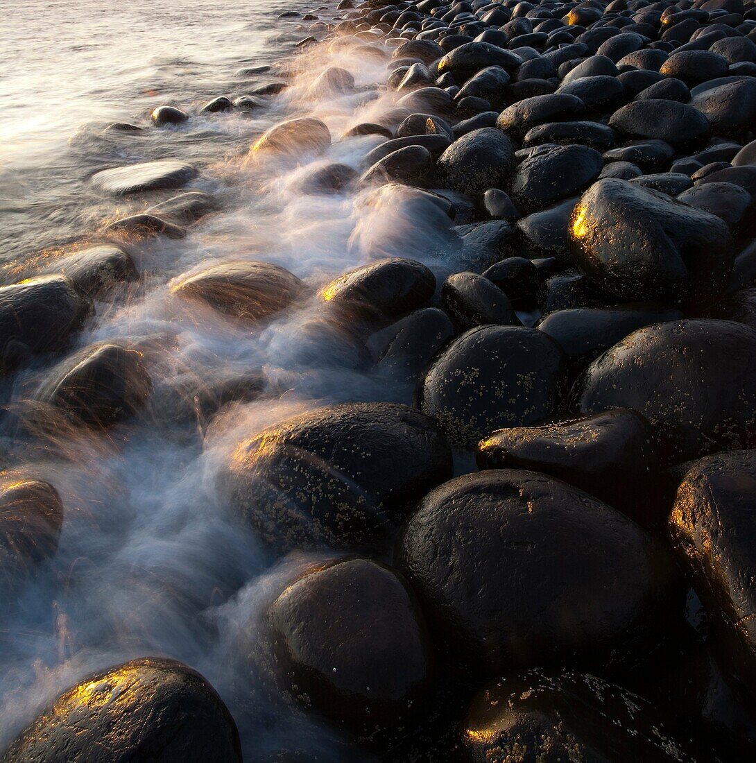 England, Northumberland, Embleton Bay Waves crash againt the sea scultured rocks dominating the coastline of Embleton Bay