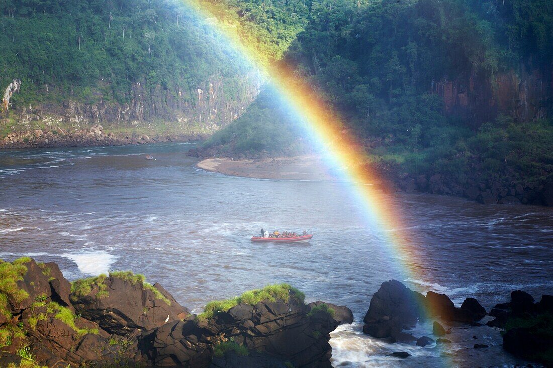 Argentina, Misiones, Iguazu National Park Rainbow near the impressive Iguazu waterfalls - A world heritage site