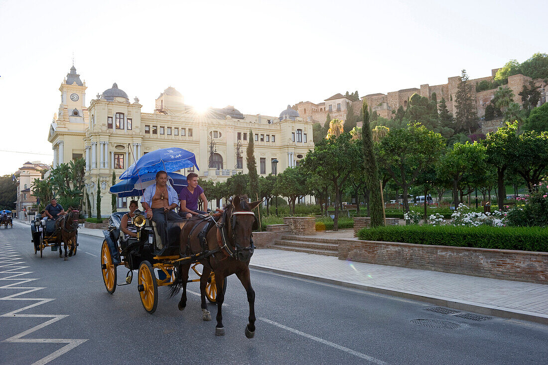 Horse-drawn carriages in front of Alcazaba fortress and town hall, Malaga, Andalusia, Spain, Europe