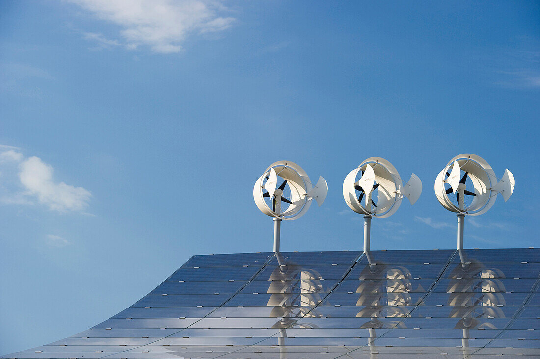 Small wind turbines and solar installations on the roof of Hotel Victoria, Freiburg im Breisgau, Baden-Wuerttemberg, Germany, Europe