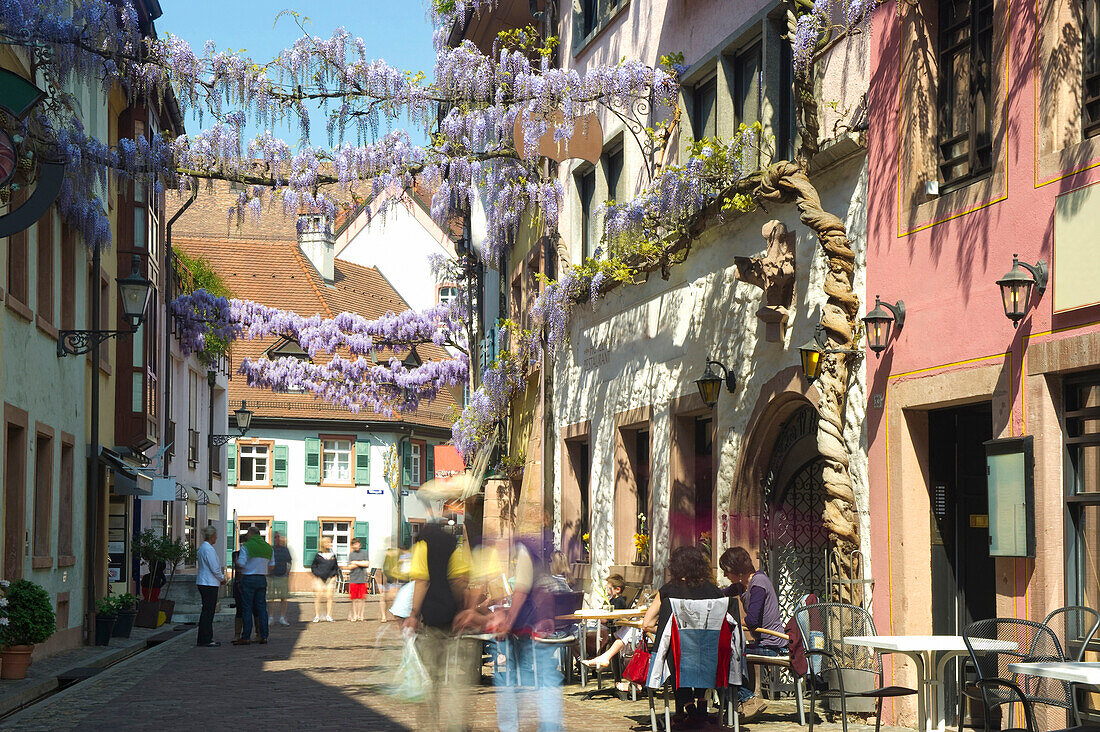 Konviktgasse, people with motion blur, historic part of Freiburg im Breisgau, Baden-Würtemberg, Germany