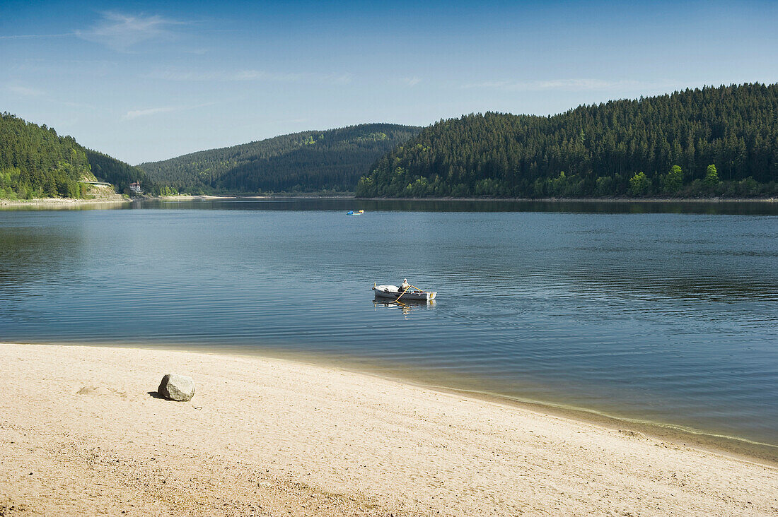 Boat on lake Schluchsee in the sunlight, Black Forest, Baden-Wuerttemberg, Germany, Europe