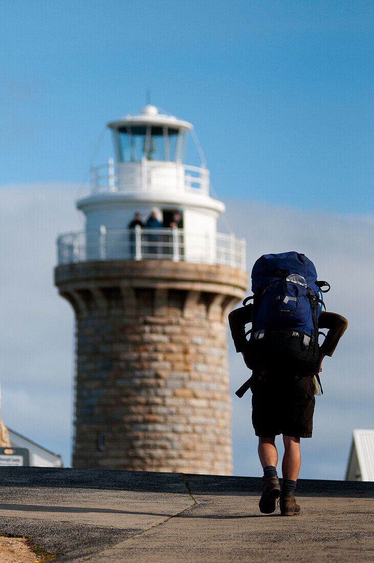 Hiker near lighthouse at South East Point, Wilsons Promontory National Park, Victoria, Australia