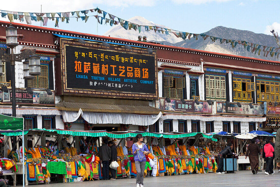 Shops with prayer flags at Barkhor Square in the old part of Lha, Tibet Autonomous Region, People's Republic of China