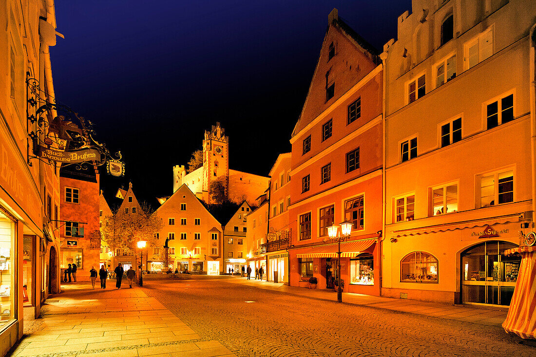 Illuminated houses at pedestrian area and Fuessen Castle in the evening, Fuessen, East Allgaeu, Germany, Europe