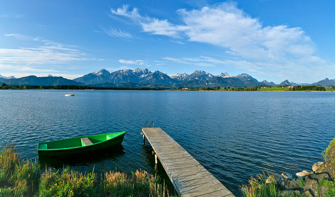 Boat and jetty at lake Hopfensee, East Allgaeu, Germany, Europe