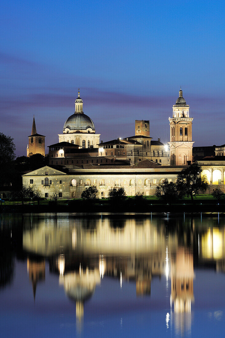 Illuminated old town of Mantua reflecting in river of Mincio, Mantua, Lombardy, Italy, Europe