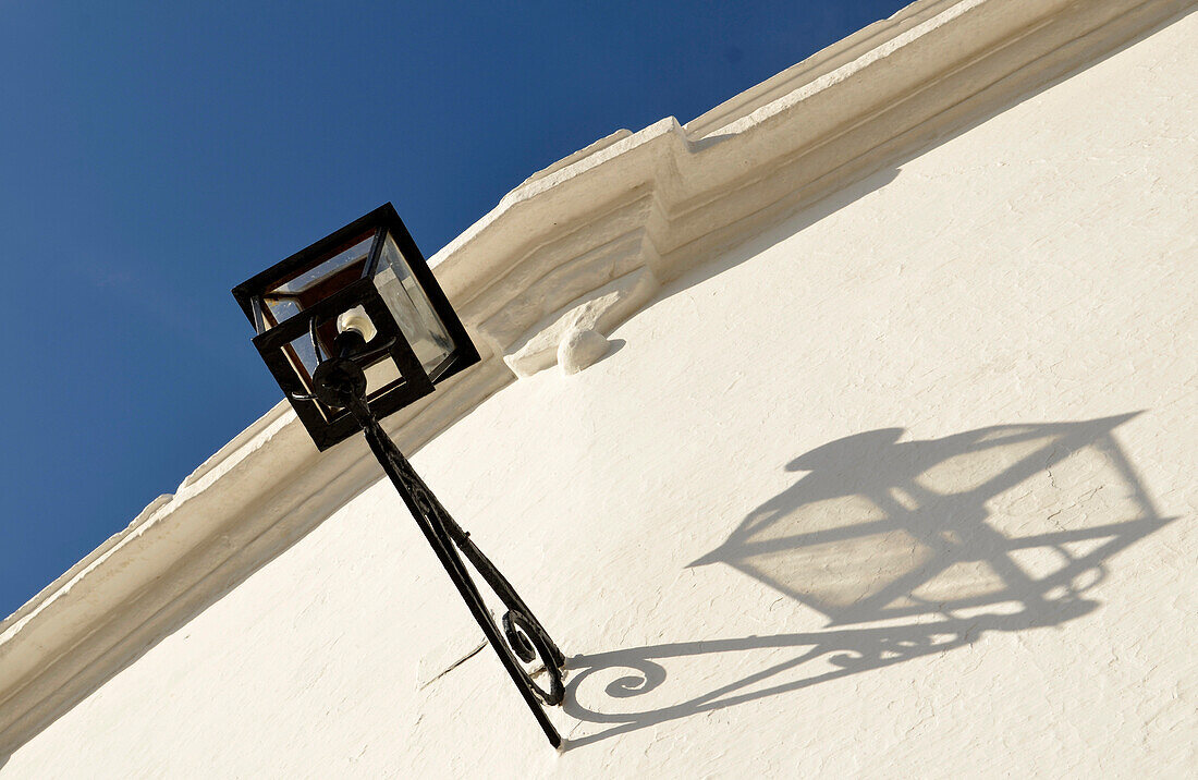 Lantern on white wall, Sevilla, Andalusia, Spain, Europe