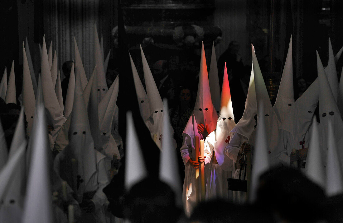 Nazarenos of the brotherhood La Borriquita at the church El Salvador, Sevilla, Andalusia, Spain, Europe