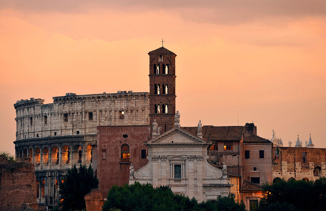 Basilica of Saint Mary in Cosmedin and Colosseum in the afterglow, Rome, Lazio, Italy