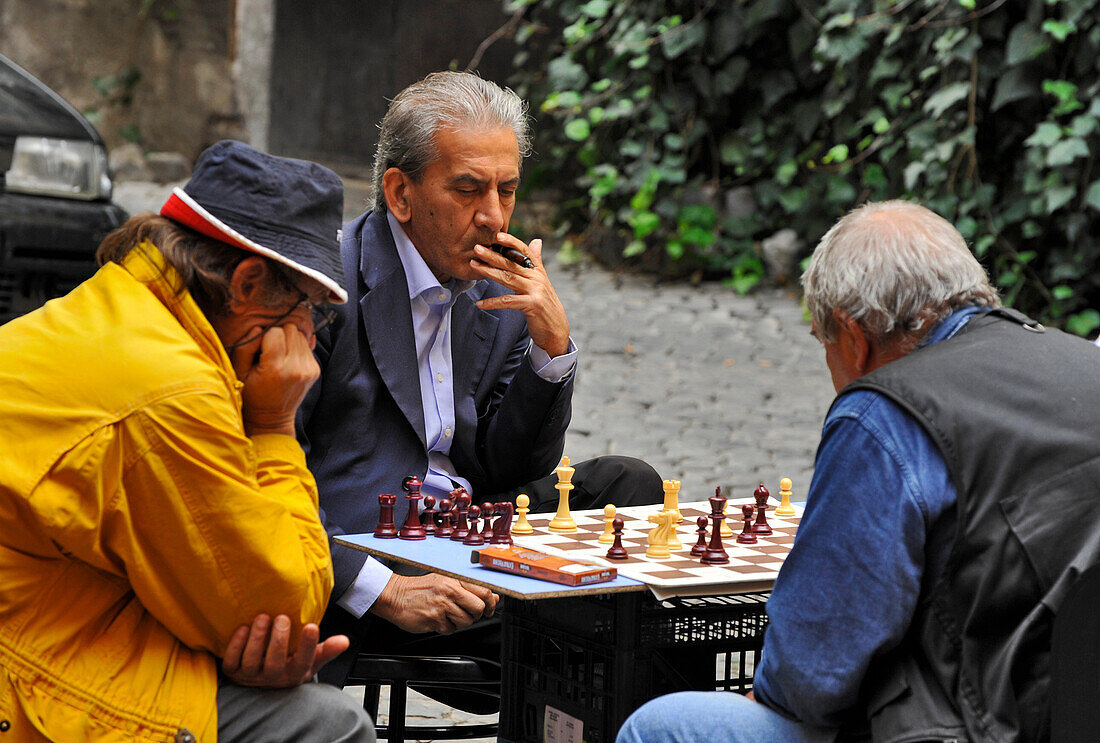Mature men playing chess, Rome, Lazio, Italy, Europe