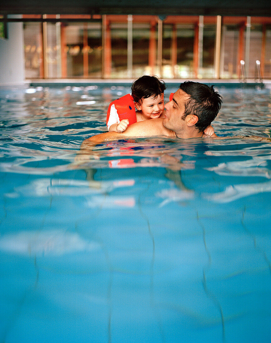 Father and kid in the pool, Hotel Post Bezau, Bregenz, Vorarlberg, Austria
