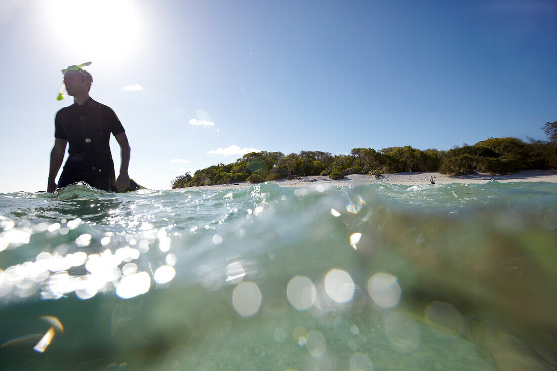 Snorkeler near Heron Island, eastern part is part of the Capricornia Cays National Park, Great Barrier Reef Marine Park, UNESCO World Heritage Site, Queensland, Australia