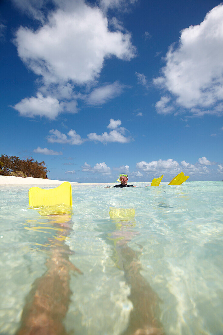 Snorkeler with fins near Heron Island, eastern part is part of the Capricornia Cays National Park, Great Barrier Reef Marine Park, UNESCO World Heritage Site, Queensland, Australia