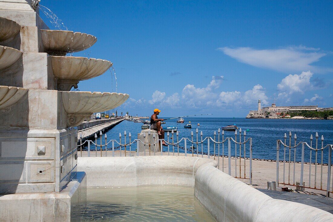 Man fish in the Malecon of Havana Cuba