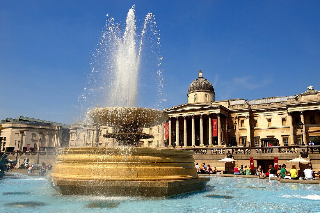 Fountains in Trafalgar Square London, with National Gallery behind