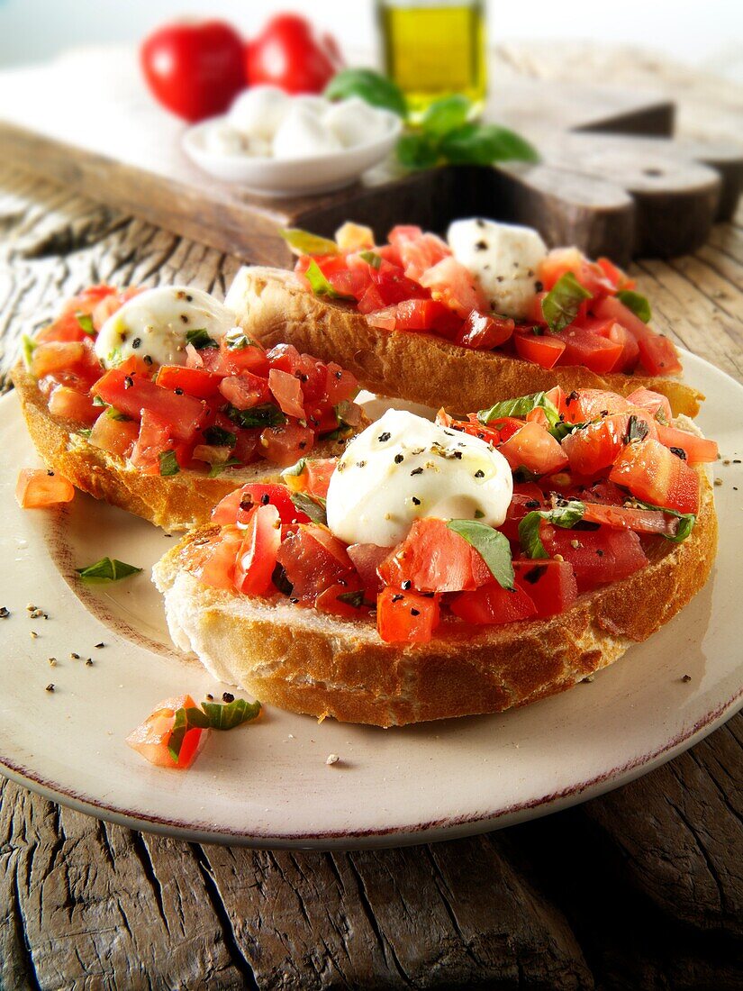 Fresh chopped beefsteak tomato with mini mozerellas bruschettas