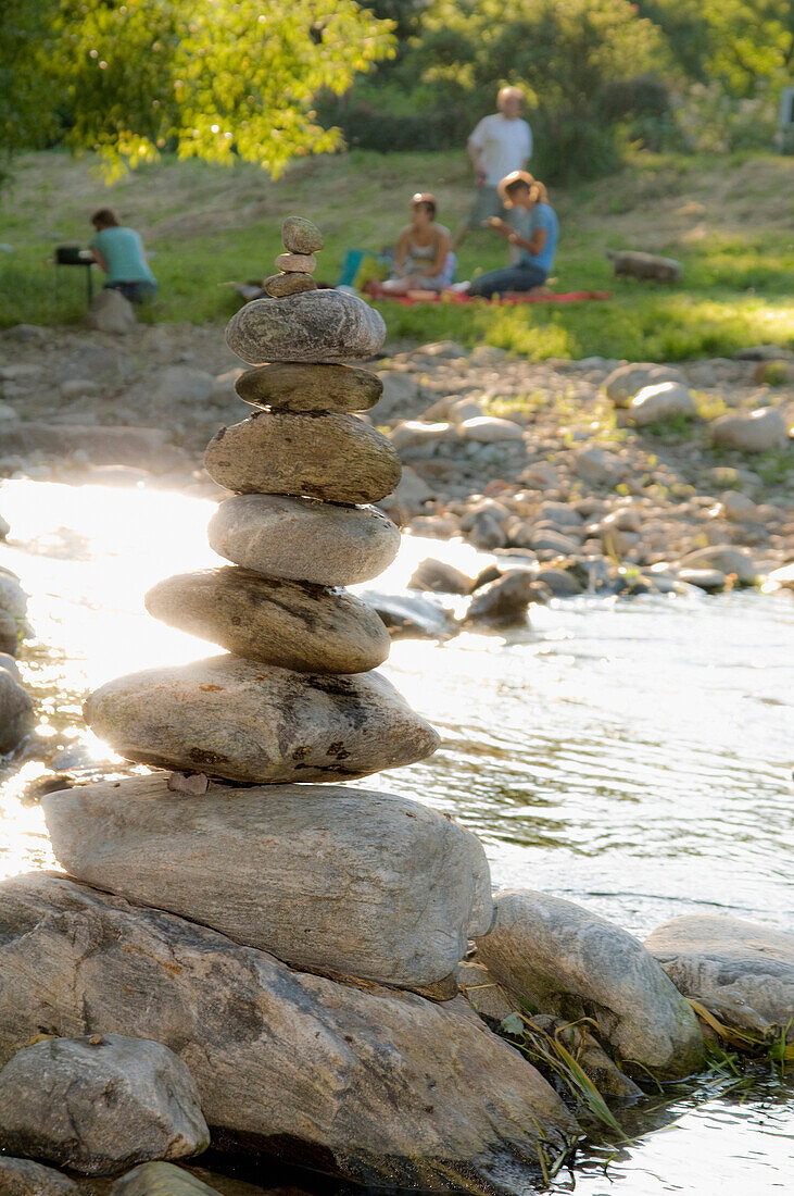 Stack of stones beside Dreisam river bank, Freiburg im Breisgau, Baden-Wurttemberg, Germany