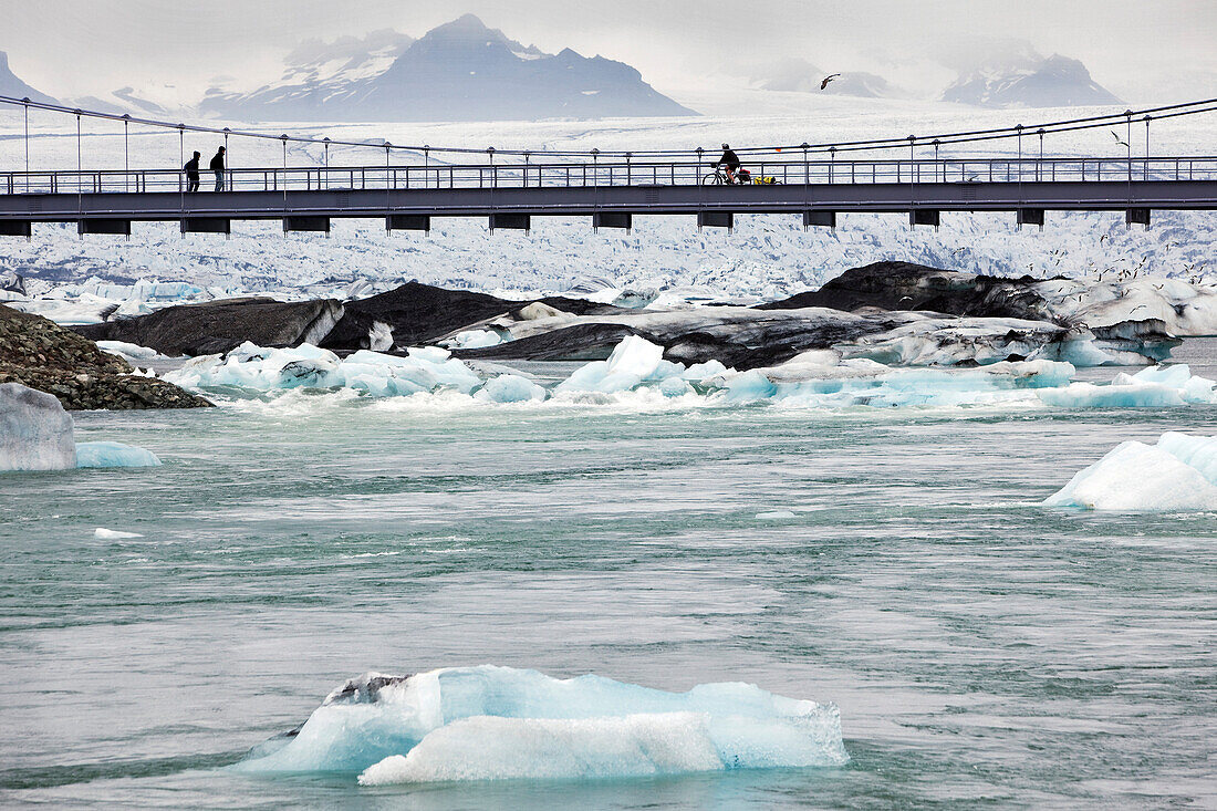 Crossing the Bridge Over the Spur of Ice, Icebergs on Lake Jokulsarlon, An Extension of the Vatnajokull Glacier Or Glacier of Lakes, the Largest Icecap in Iceland, Possibly Even Europe
