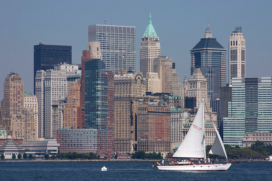 Sailboat Nearing the Port of New York at the Foot of the Buildings of Downtown, Financial District, New York City, United States of America, Usa