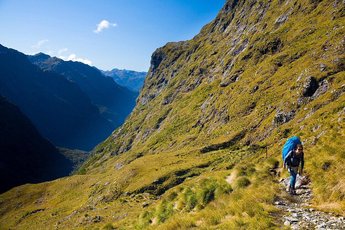 New Zealand, Southland, Fiordland National Park Tramper heading towards the Centre Pass on the Dusky Track
