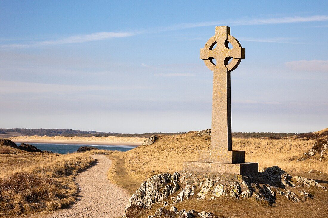Llanddwyn Island, Newborough, Anglesey, North Wales, UK, Europe Celtic stone cross and footpath on Isle of Anglesey coast