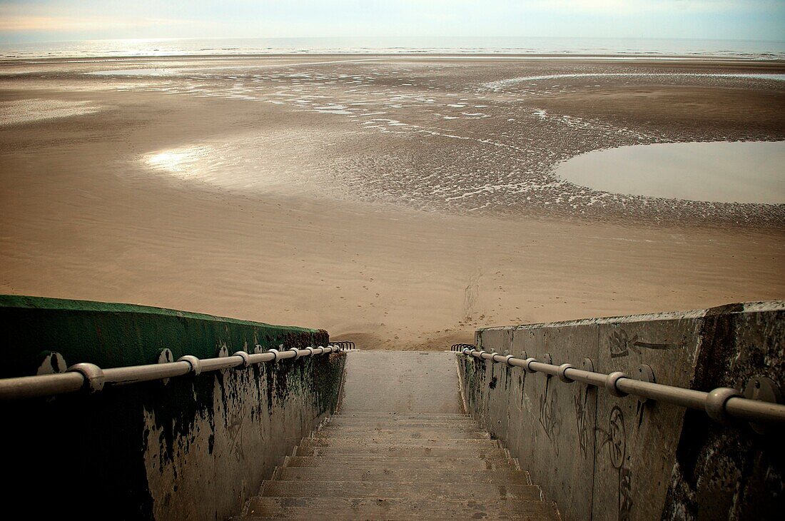 Steps down to empty beach at Blackpool