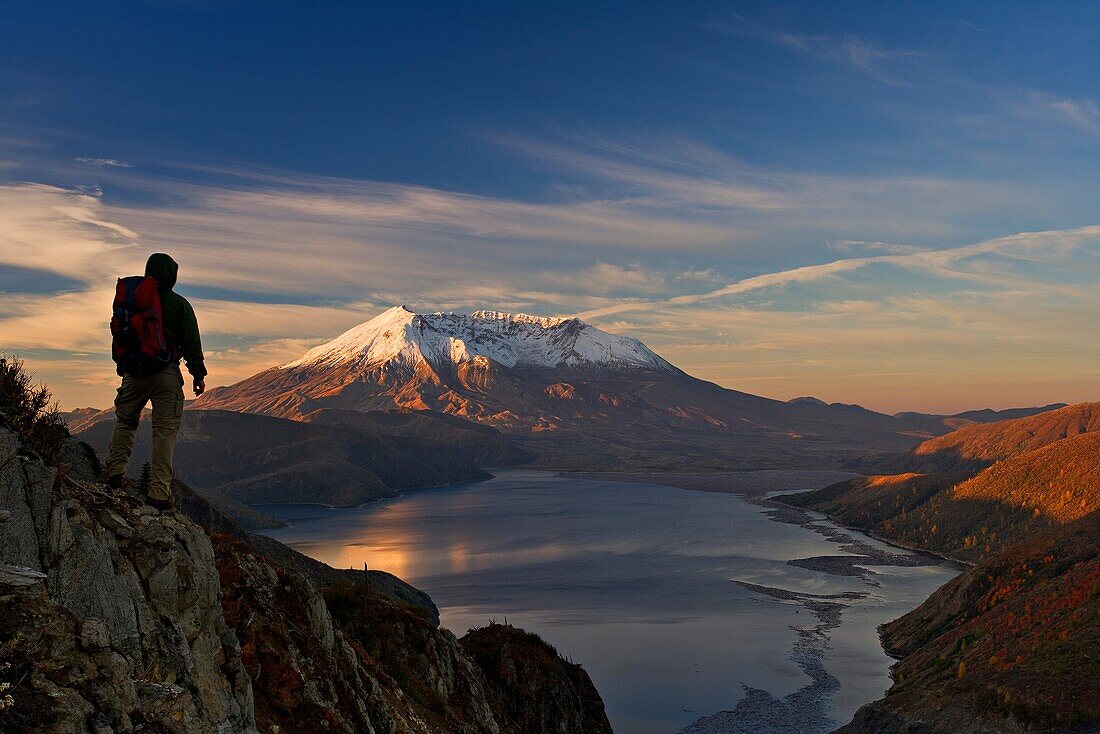 Hiker is enjoying view of autumn Mt St Helens volcano from near Independence pass