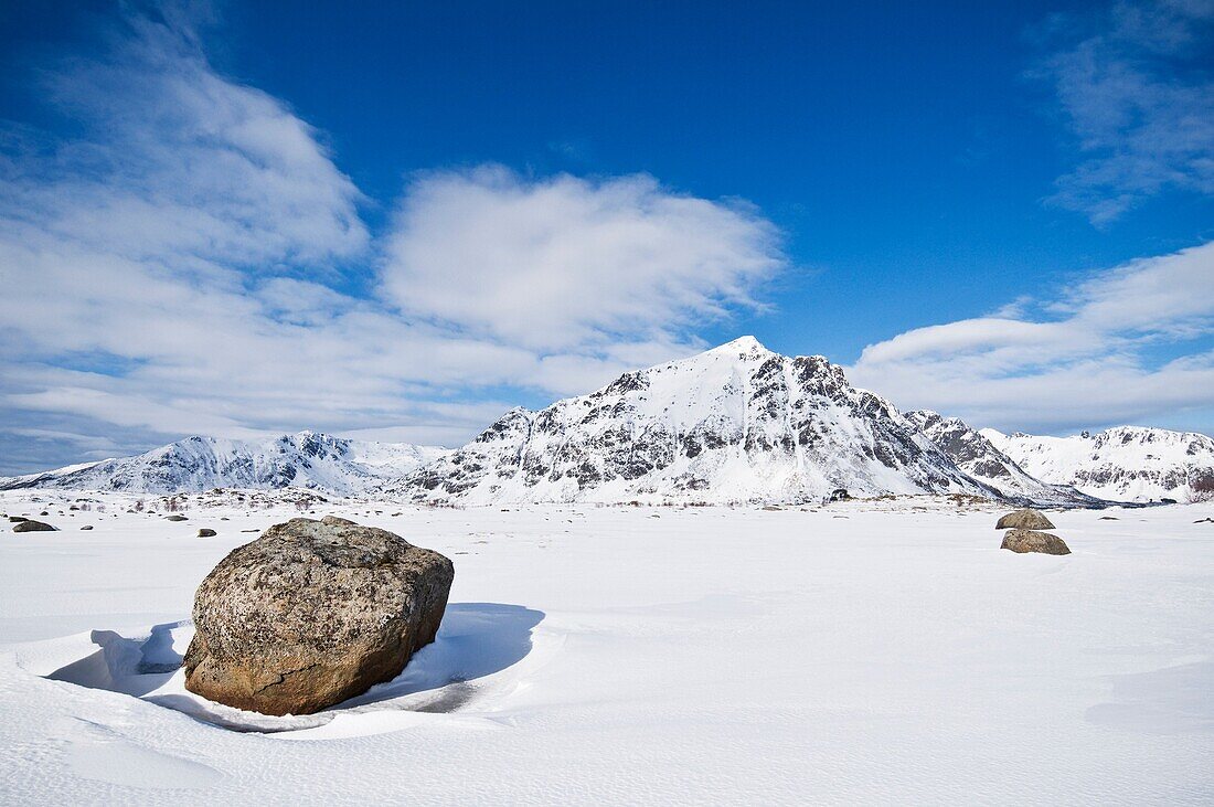 Justadtind mountain peak rises in distance in winter, near Stamsund, Vestvågøy, Lofoten Islands, Norway