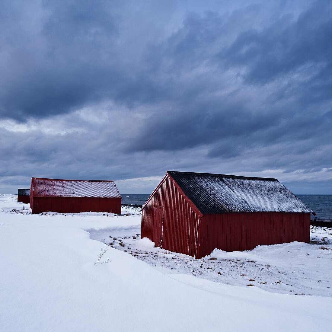 Boat sheds in snow, Eggum, Vestvågøy, Lofoten islands, Norway