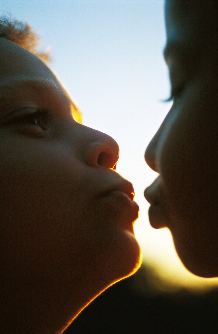 Two children about to kiss, extreme close-up