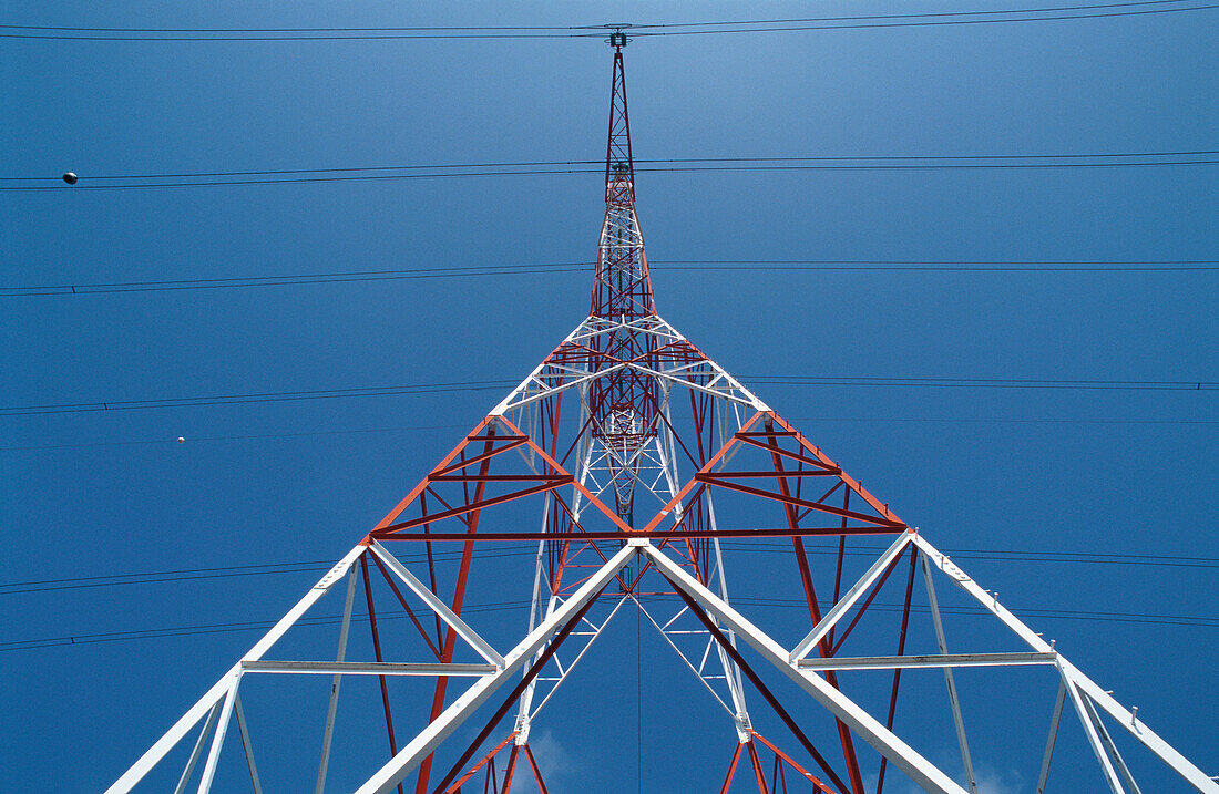 Electric transformer and power lines, low angle view