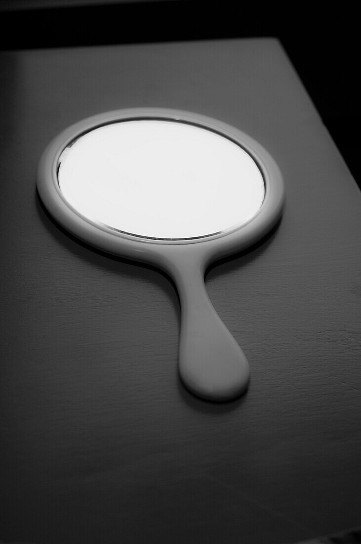 Round Hand Mirror on Table