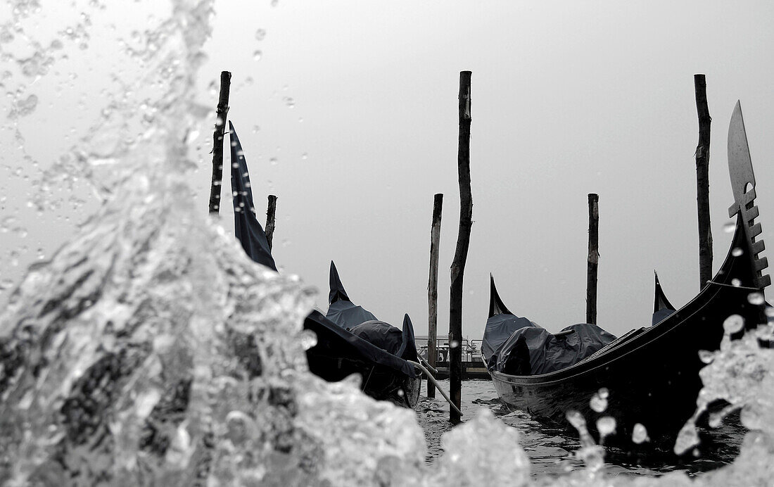 Gondolas, water spray, Venice, Italy