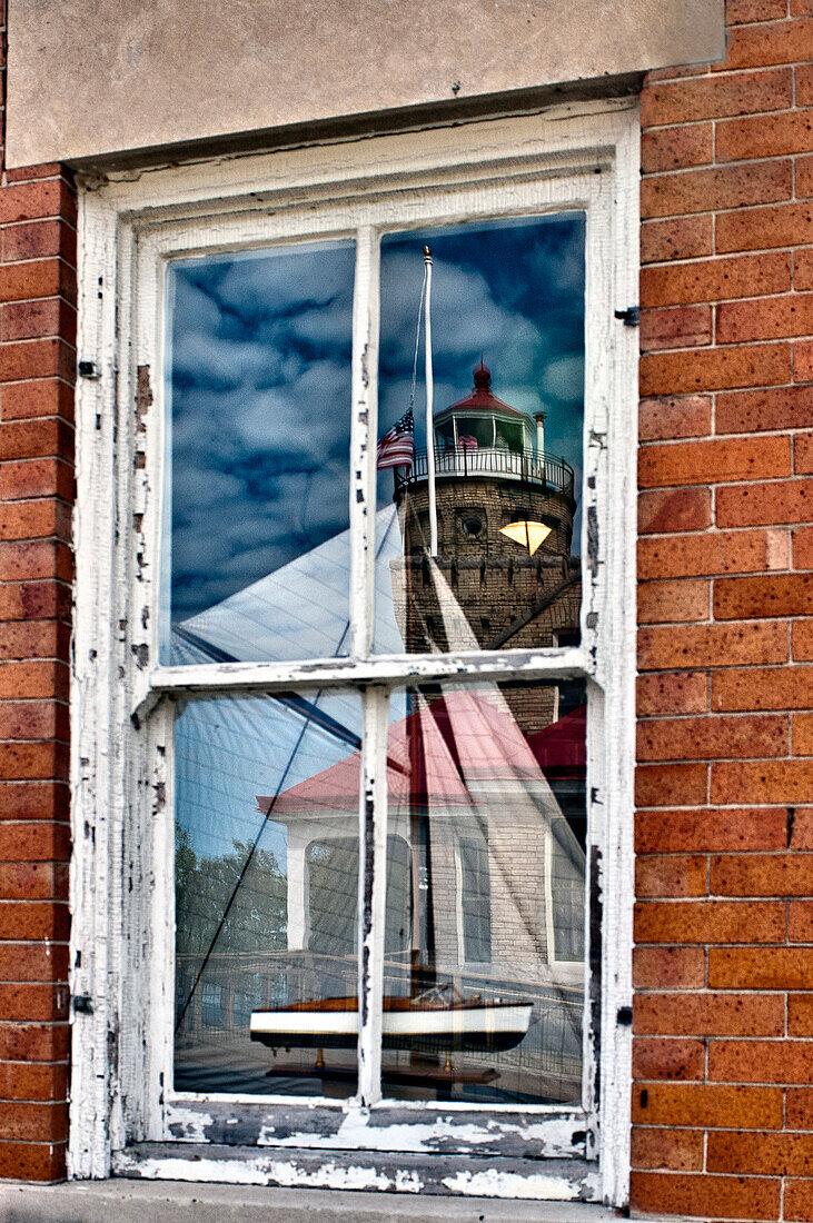 Window Reflection of Lighthouse and Boat, Mackinac Island, Michigan, US