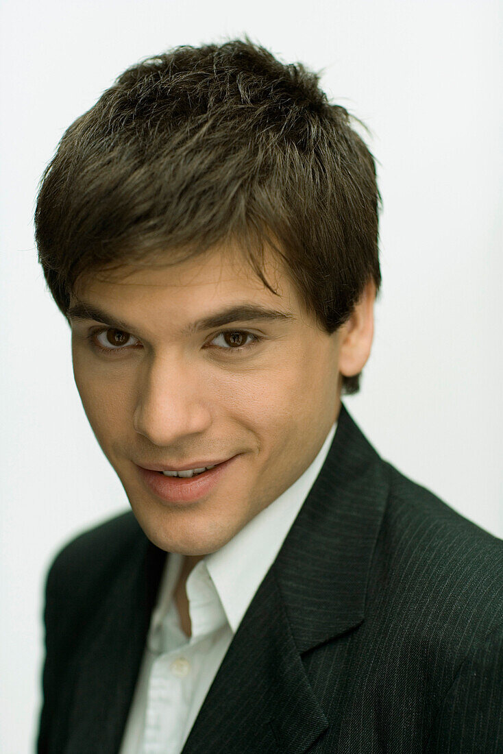 Young man smiling at camera, portrait