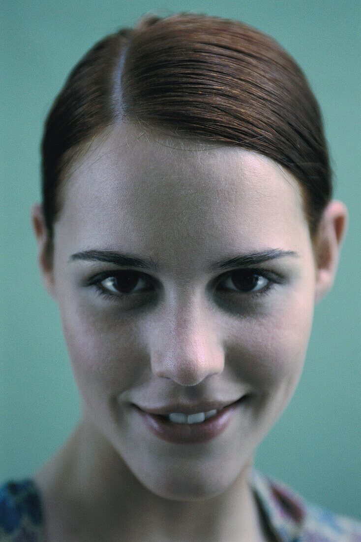 Woman smiling at camera, portrait