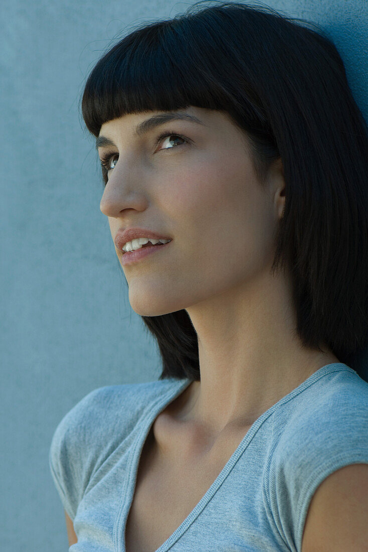 Young woman looking up, portrait