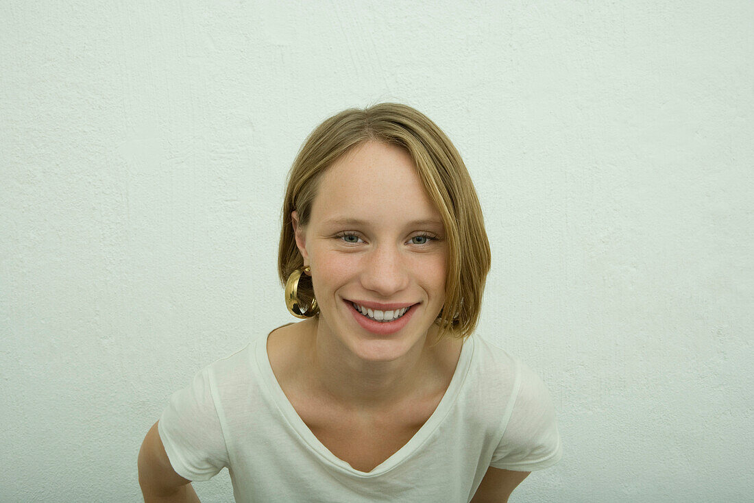 Teen girl smiling at camera, portrait