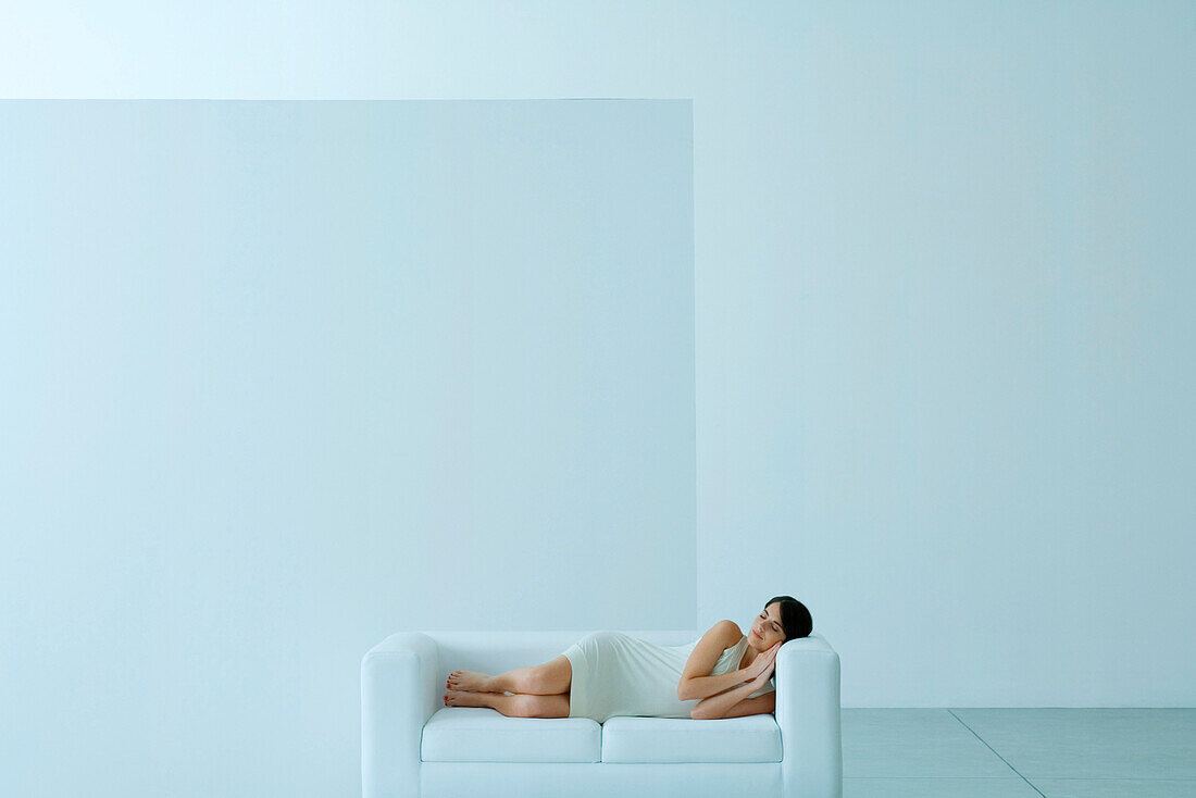 Woman napping on sofa